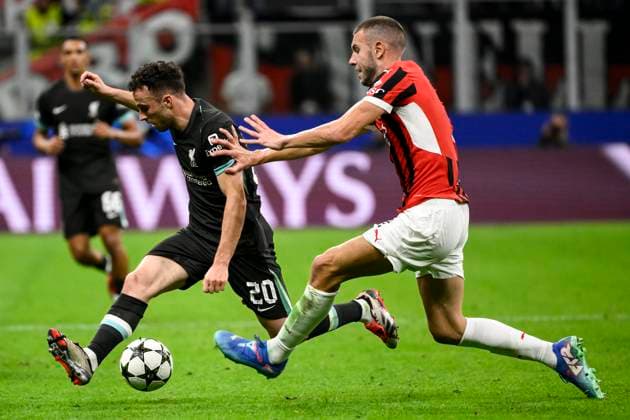 Diogo Jota of Liverpool FC and Strahinja Pavlovic of AC Milan compete for the ball during the UEFA Champions League 2024 205 football match between AC Milan and Liverpool FC at San Siro stadium in Milano (Italy), September 17, 2024. AndreaxStaccioli