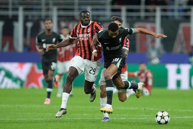 Youssouf Fofana (AC Milan) and Cody Gakpo (Liverpool FC) battle for the ball, UEFA Champions League 2024 25 League Phase MD1, AC Milan v Liverpool FC, Stadio Giuseppe Meazza (San Siro), September 17, 2024, Milan, Italy.
