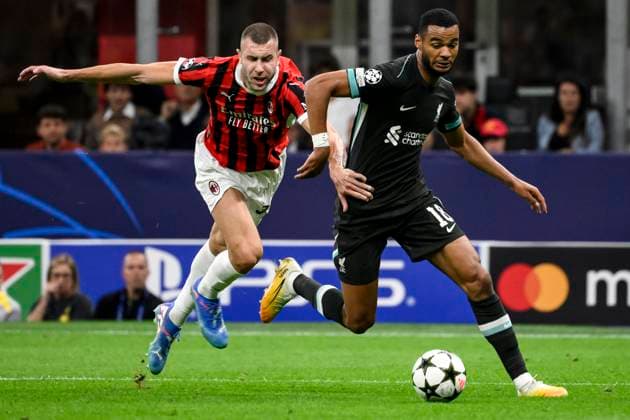 Strahinja Pavlovic of AC Milan and Cody Gakpo of Liverpool FC during the UEFA Champions League 2024 205 football match between AC Milan and Liverpool FC at San Siro stadium in Milano (Italy), September 17, 2024. AndreaxStaccioli