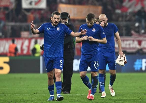 FC Bayern München v GNK Dinamo - UEFA Champions League 2024 25 League Phase MD1 MUNICH, GERMANY - SEPTEMBER 17: Arijan Ademi of Dinamo Zagreb, Stefan Ristovski of Dinamo Zagreb and Josip Misic of Dinamo Zagreb reacts after the UEFA Champions League 2024 25 League Phase MD1 match between FC Bayern München and GNK Dinamo at Football Arena Munich on September 17, 2024 in Munich, Germany.  MarkoxLukunic PIXSELL