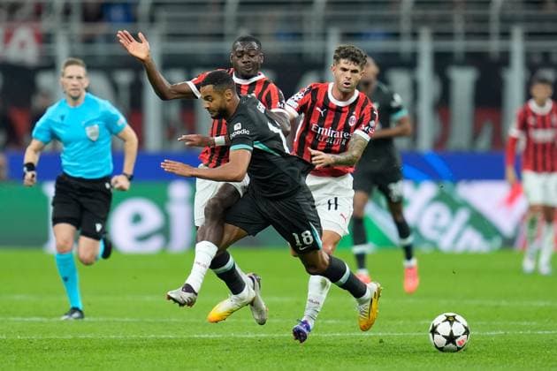 Cody Gakpo of Liverpool FC competes for the ball with Christian Pulisic of AC Milan during the Uefa Champions League match between AC Milan and Liverpool at Stadio San Siro Milan Italy on 17 September 2024. Milan Stadio San Siro Milan Italy Copyright: xPhotoxGoalxPixx SP24-989-039