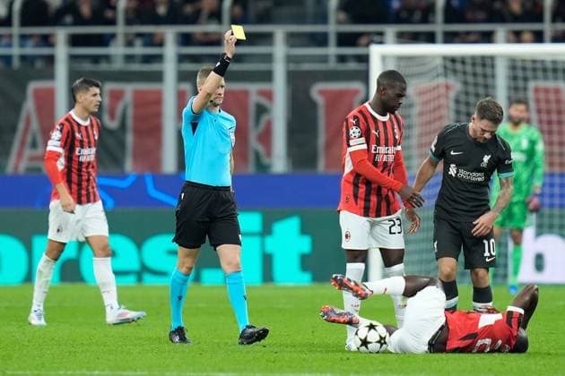 Alexis Mac Allister of Liverpool FC is shown a yellow card by the referee during the Uefa Champions League match between AC Milan and Liverpool at Stadio San Siro Milan Italy on 17 September 2024. Milan Stadio San Siro Milan Italy Copyright: xPhotoxGoalxPixx SP24-989-040