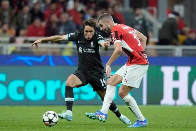 Federico Chiesa (Liverpool FC) and Strahinja Pavlovic (AC Milan) battle for the ball, UEFA Champions League 2024 25 League Phase MD1, AC Milan v Liverpool FC, Stadio Giuseppe Meazza (San Siro), September 17, 2024, Milan, Italy.