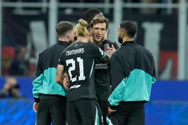 Federico Chiesa (Liverpool FC) and Kostas Tsimikas (Liverpool FC) celebrate after winning, UEFA Champions League 2024 25 League Phase MD1, AC Milan v Liverpool FC, Stadio Giuseppe Meazza (San Siro), September 17, 2024, Milan, Italy.