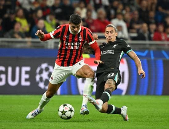 (240918) -- MILAN, Sept. 18, 2024 -- AC Milan s Alvaro Morata (L) vies with Liverpool s Kostas Tsimikas during the first round match of UEFA Champions League between AC Milan and Liverpool in Milan, Italy, Sept.17, 2024. (Photo by Xinhua) (SP)ITALY-MILAN-FOOTBALL-UEFA CHAMPIONS LEAGUE-AC MILAN VS LIVERPOOL AlbertoxLingria 