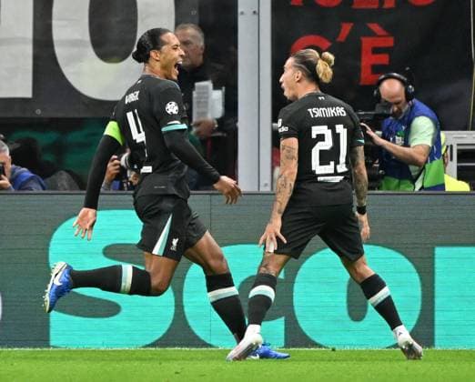 (240918) -- MILAN, Sept. 18, 2024 -- Liverpool s Virgil van Dijk (L) celebrates his goal with teammate Kostas Tsimikas during the first round match of UEFA Champions League between AC Milan and Liverpool in Milan, Italy, Sept.17, 2024. (Photo by Xinhua) (SP)ITALY-MILAN-FOOTBALL-UEFA CHAMPIONS LEAGUE-AC MILAN VS LIVERPOOL AlbertoxLingria 