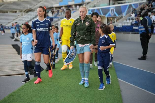 Gaetane Thiney of Paris FC and Alex Greenwood of Man City lead their sides out Paris FC Women v Manchester City Women, UEFA Women s Champions League, Second Round, Football, Stade Charlety , Paris, France, 18 Sep 2024 EDITORIAL USE ONLY No use with unauthorised audio, video, data, fixture lists, club league logos or live services. Online in-match use limited to 120 images, no video emulation. No use in betting, games or single club league player publications.  Copyright: xDavexWinter Shutterstockx 14722161aa