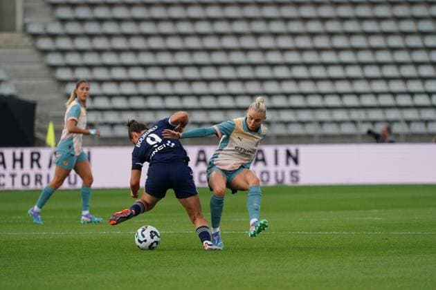 Mathilde Bourdieu of Paris FC is tackled by Alex Greenwood of Man City Paris FC Women v Manchester City Women, UEFA Women s Champions League, Second Round, Football, Stade Charlety , Paris, France, 18 Sep 2024 EDITORIAL USE ONLY No use with unauthorised audio, video, data, fixture lists, club league logos or live services. Online in-match use limited to 120 images, no video emulation. No use in betting, games or single club league player publications.  Copyright: xDavexWinter Shutterstockx 14722161aq