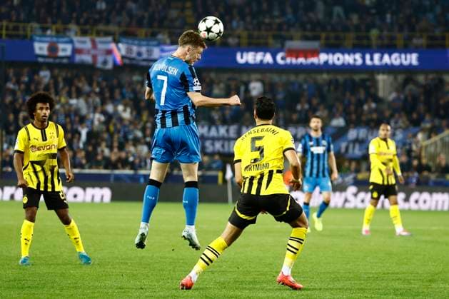 Club Brugge v Borussia Dortmund - UEFA Champions League BRUGGE, BELGIUM - SEPTEMBER 18 : Skov Olsen Andreas forward of Club Brugge and Bensebaini Ramy defender of Borussia Dortmund during the UEFA Champions League - League phase matchday 1 match between Club Brugge and Borussia Dortmund at the Jan Breydel stadium on September 18, 2024 in Bruges , Belgium , 18 09 2024 Brugge Belgium  Copyright: xJanxDexMeuleneirx