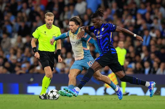 Manchester City v Inter Milan Champions League 18 09 2024. Jack Grealish (10) of Manchester City and Yann Aurel Bisseck (31) of Inter Milan challenge for the ball during the Champions League match between Manchester City and Inter Milan at the Etihad Stadium, Manchester, England on 18 September 2024. Manchester Etihad Stadium Manchester England Editorial use only , Copyright: xConorxMolloyx PSI-20434-0034