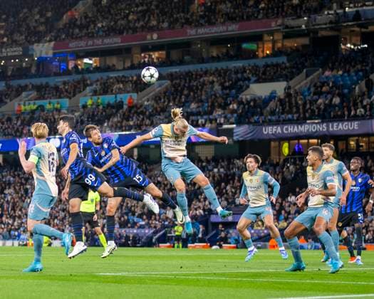 18th September 2024; Etihad Stadium, Manchester, England; UEFA Champions League Football, Manchester City versus Inter Milan; Erling Haland of Manchester City heads the ball in front of Francesco Acerbi of Inter Milan  ActionPlus12694318 TimxWilliams