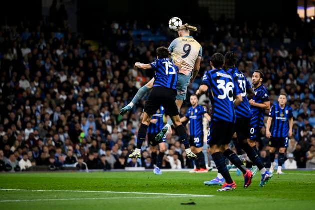 Manchester City FC V FC internazionale - UEFA Champions League Erling Haaland of Manchester CIty FC compete for a header with Francesco Acerbi of FC Internazionale during the UEFA Champions League 2024 25 League Phase MD1 football match between Manchester City FC and FC Internazionale. Manchester United, ManU Kingdom Copyright: xNicolòxCampox