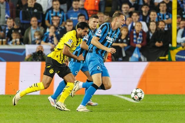 Borussia s Emre Can and Club s Gustaf Nilsson fight for the ball during a soccer game between Belgian Club Brugge KV and German Borussia Dortmund, Wednesday 18 September 2024 in Brugge, on the day one of the UEFA Champions League league phase. KURTxDESPLENTER  x100920264x