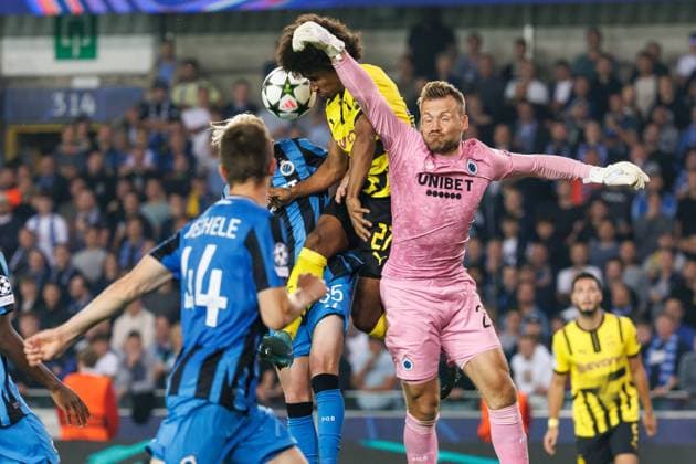Club s Joaquin Seys, Borussia s Karim Adeyemi and Club s goalkeeper Simon Mignolet fight for the ball during a soccer game between Belgian Club Brugge KV and German Borussia Dortmund, Wednesday 18 September 2024 in Brugge, on the day one of the UEFA Champions League league phase. KURTxDESPLENTER  x100920265x