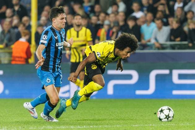 Club s Hugo Vetlesen and Borussia s Karim Adeyemi fight for the ball during a soccer game between Belgian Club Brugge KV and German Borussia Dortmund, Wednesday 18 September 2024 in Brugge, on the day one of the UEFA Champions League league phase. KURTxDESPLENTER  x100920310x