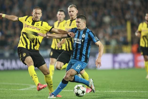 Borussia s Waldemar Anton and Club s Christos Tzolis fight for the ball during a soccer game between Belgian Club Brugge KV and German Borussia Dortmund, Wednesday 18 September 2024 in Brugge, on the day one of the UEFA Champions League league phase. BRUNOxFAHY  x100920583x