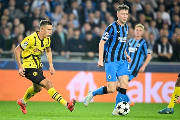Club Brugge v Borussia Dortmund - UEFA Champions League BRUGGE, BELGIUM - SEPTEMBER 18 : Schlotterbeck Nico defender of Borussia Dortmund and Skov Olsen Andreas forward of Club Brugge during the UEFA Champions League - League phase matchday 1 match between Club Brugge and Borussia Dortmund at the Jan Breydel stadium on September 18, 2024 in Bruges , Belgium , 18 09 2024 Brugge Belgium  Copyright: xNicoxVereeckenx