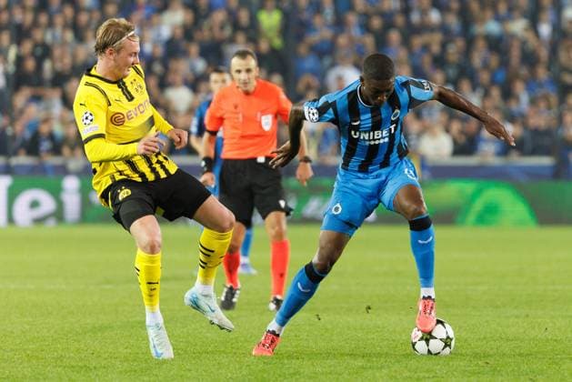 Borussia s Julian Brandt and Club s Joel Ordonez fight for the ball during a soccer game between Belgian Club Brugge KV and German Borussia Dortmund, Wednesday 18 September 2024 in Brugge, on the day one of the UEFA Champions League league phase. KURTxDESPLENTER  x100920789x