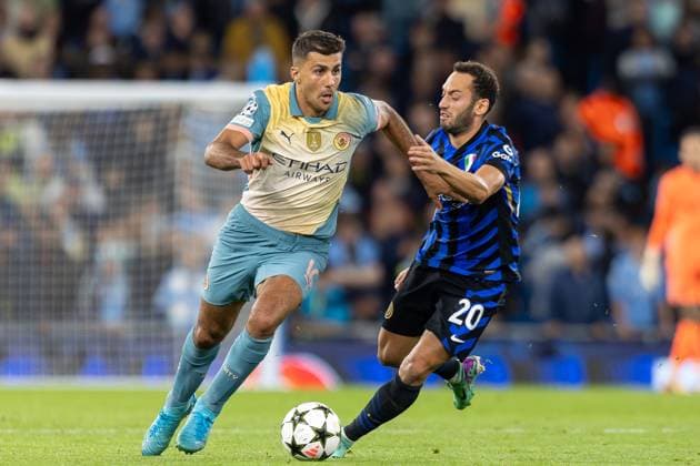 Manchester City v Inter Milan Champions League 18 09 2024. Inter Milan midfielder Hakan Ã‡alhanoÄülu (20) battles with Manchester City midfielder Rodri (16) during the Champions League match between Manchester City and Inter Milan at the Etihad Stadium, Manchester, England on 18 September 2024. Editorial use only , Copyright: xIanxStephenx PSI-20445-0038