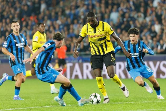 Club s Maxim De Cuyper and Borussia s Serhou Guirassy fight for the ball during a soccer game between Belgian Club Brugge KV and German Borussia Dortmund, Wednesday 18 September 2024 in Brugge, on the day one of the UEFA Champions League league phase. KURTxDESPLENTER  x100922979x