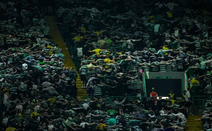 Celtic fans do a huddle in the stands. Celtic v Slovan Bratislava, UEFA Champions League, Group Stage, Football, Celtic Park, Glasgow, Scotland, UK, 18 Sep 2024 EDITORIAL USE ONLY No use with unauthorised audio, video, data, fixture lists, club league logos or live services. Online in-match use limited to 120 images, no video emulation. No use in betting, games or single club league player publications.  Copyright: xStuartxWallace Shutterstockx 14722221aq