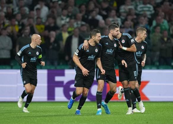 Kevin Wimmer of Slovan Bratislava celebrates with team mates after scoring to reduce Celtic s lead to 3-1. Celtic v Slovan Bratislava, UEFA Champions League, Group Stage, Football, Celtic Park, Glasgow, Scotland, UK, 18 Sep 2024 EDITORIAL USE ONLY No use with unauthorised audio, video, data, fixture lists, club league logos or live services. Online in-match use limited to 120 images, no video emulation. No use in betting, games or single club league player publications.  Copyright: xStuartxWallace Shutterstockx 14722221au
