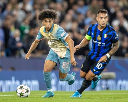 18th September 2024; Etihad Stadium, Manchester, England; UEFA Champions League Football, Manchester City versus Inter Milan; Rico Lewis of Manchester City under pressure from Lautaro Martinez of Inter Milan  ActionPlus12694336 TimxWilliams