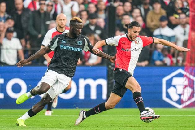 UEFA Champions League: Feyenoord v Bayer 04 Leverkusen Rotterdam - Victor Boniface of Bayer 04 Leverkusen, Ramiz Zerrouki of Feyenoord during the first round of new format of the Champions League 2024 2025. The match is set between Feyenoord and Bayer 04 Leverkusen at Stadion Feijenoord De Kuip on 19 September 2024 in Rotterdam, The Netherlands. Copyright: xYannickxVerhoevenx