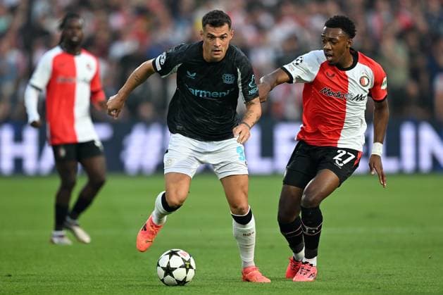 Rotterdam, De Kuip, 19 09 24, GER, Men, UEFA Champions League, Season 2024 2025, Feyenoord Rotterdam Bayer 04 Leverkusen Picture from left in duel Granit XHAKA Leverkusen and Antoni MILAMBO Feyenoord Only for editorial use UEFA regulations prohibit any use of photographs as image sequences and or quasi video Suedholland Netherlands