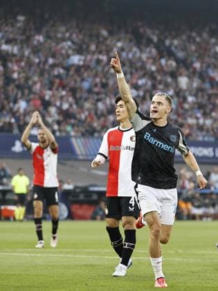 ROTTERDAM - (l-r) Ramiz Zerrouki of Feyenoord, Inbeom Hwang of Feyenoord balks, Florian Wirtz of Bayer 04 Leverkusen celebrates the 0-1 during the UEFA Champions League match between Feyenoord Rotterdam and Bayer 04 Leverkusen at Feyenoord Stadion de Kuip on Sept. 19, 2024 in Rotterdam, Netherlands. ANP MAURICE VAN STEEN UEFA Champions League 2024 25 xVIxANPxSportx xxANPxIVx 508861641 originalFilename: 508861641.jpg