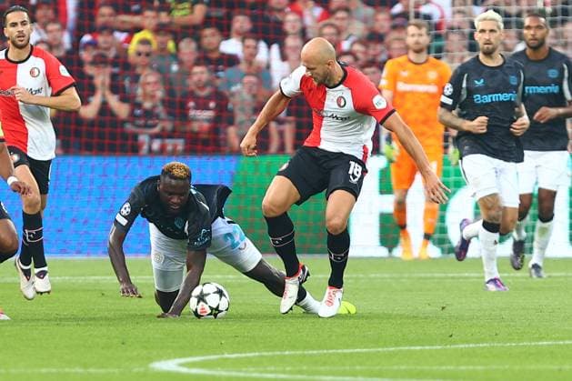 in duel, action, with Victor Boniface 22 Bayer 04 Leverkusen Gernot Trauner 18 Feyenoord Rotterdam Feyenoord Rotterdam vs Bayer 04 Leverkusen, UEFA Champions League, Soccer, Matchday 1, Season 2024 2025, 19 09 2024 Photo kolbert press Ant Palmer Stadion Rotterdam De Kuip Netherlands Copyright: xkolbert-press AntxPalmerx