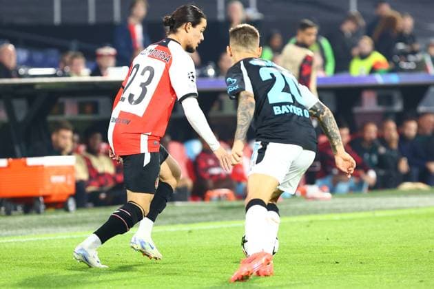 Anis Hadj Moussa 23 Feyenoord Rotterdam in duel, action, with Alex Grimaldo 20 Bayer 04 Leverkusen Feyenoord Rotterdam vs Bayer 04 Leverkusen, UEFA Champions League, Soccer, Matchday 1, Season 2024 2025, 19 09 2024 Photo kolbert press Ant Palmer Stadion Rotterdam De Kuip Netherlands Copyright: xkolbert-press AntxPalmerx