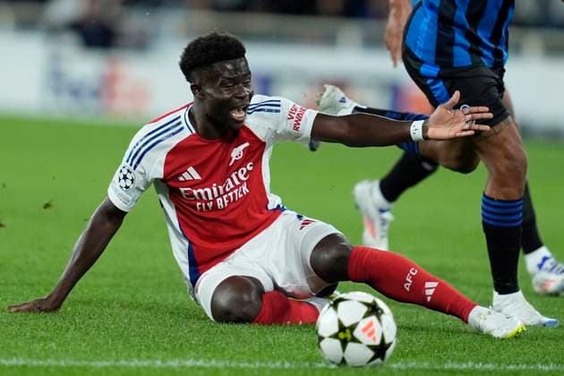 Bukayo Saka (Arsenal FC) lies on the ground, UEFA Champions League 2024 25 League Phase MD1, Atalanta BC v Arsenal FC, Gewiss Stadium, September 19, 2024, Bergamo, Italy.