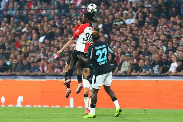 Jordan Lotomba 30 Feyenoord Rotterdam in duel, action, with Victor Boniface 22 Bayer 04 Leverkusen Feyenoord Rotterdam vs Bayer 04 Leverkusen, UEFA Champions League, Soccer, Matchday 1, Season 2024 2025, 19 09 2024 Photo kolbert press Ant Palmer Stadion Rotterdam De Kuip Netherlands Copyright: xkolbert-press AntxPalmerx