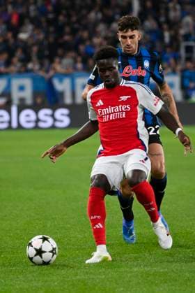 19th September 2024; Gewiss Stadium, Bergamo, Italy, UEFA Champions League Football, Atalanta versus Arsenal; Bukayo Saka of Arsenal FC holds off Matteo Ruggeri of Atalanta BC  ActionPlus12694743 BestxImages