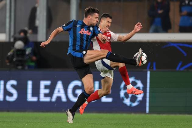 Bergamo, Italy, 19th September 2024. Berat Djimsiti of Atalanta challenges Gabriel Martinelli of Arsenal FC during the UEFA Champions League match at Gewiss Stadium, Bergamo. Picture credit should read: Jonathan Moscrop Sportimage EDITORIAL USE ONLY. No use with unauthorised audio, video, data, fixture lists, club league logos or live services. Online in-match use limited to 120 images, no video emulation. No use in betting, games or single club league player publications. SPI-3299-0036
