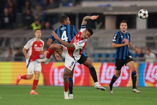 Bergamo, Italy, 19th September 2024. Isak Hien of Atalanta clashes with Gabriel Jesus of Arsenal FC during the UEFA Champions League match at Gewiss Stadium, Bergamo. Picture credit should read: Jonathan Moscrop Sportimage EDITORIAL USE ONLY. No use with unauthorised audio, video, data, fixture lists, club league logos or live services. Online in-match use limited to 120 images, no video emulation. No use in betting, games or single club league player publications. SPI-3299-0037