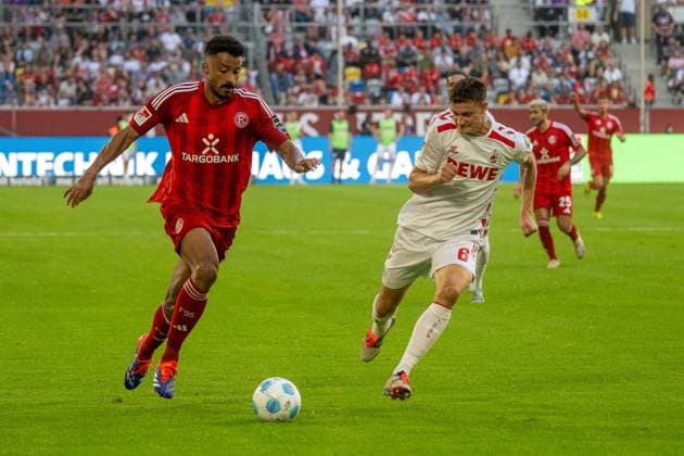 21 09 2024, Soccer 2 Bundesliga, Season 2024 2025, 06 Matchday, Fortuna Duesseldorf vs 1 FC Koeln in the Merkur Spiel Arena Rhein in Duesseldorf duel between Emmanuel Iyoha Fortuna Duesseldorf, 19 and Eric Martel 1 FC Koeln, 06 Important note In accordance with the regulations of the DFL German Football League and the DFB German Football Association, it is prohibited to utilize or have utilized photographs taken in the stadium and or of the match in the form of sequential images and or video-like photo series Foto Kirchner Media TH Copyright: xKirchner-Media THx