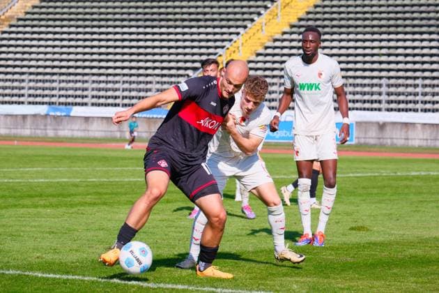 Alem Japaur 11, Würzburger Kickers Dominik Lindermeir 6, FC Augsburg II in the background Chrislain Matsima 3, FC Augsburg II during the match FC Augsburg II v Würzburger Kickers, Soccer, Men, Regionalliga Bayern 2024 2025, Matchday 10 on 21 09 2024 in Augsburg, Rosenaustadion Bayern Germany