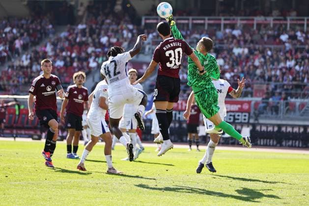 Scene with Deyovaisio Evan Zeefuik, Tjark Ernst, Mahir Emreli in front of the Berlin goal in the first round match of the 2024 2025 season between 1 FC Nuremberg and Hertha BSC in Nuremberg 21 09 2024