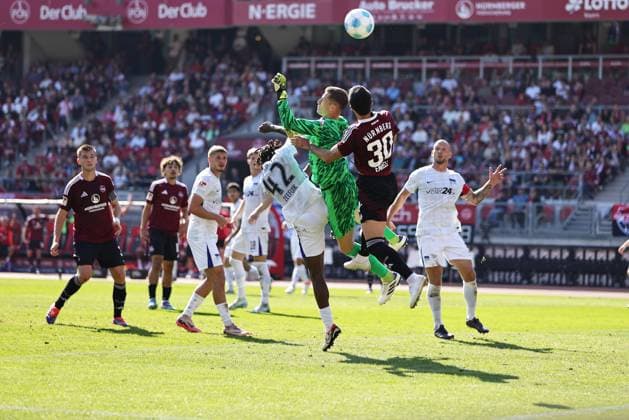 Scene with Deyovaisio Evan Zeefuik, Tjark Ernst, Mahir Emreli in front of the Berlin goal in the first round match of the 2024 2025 season between 1 FC Nuremberg and Hertha BSC in Nuremberg 21 09 2024