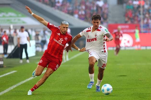 Jona Niemiec 18 Fortuna Duesseldorf in duel, action, with Julian Pauli 24 1 FC Koeln Fortuna Duesseldorf vs 1 FC Koeln, Football, 2 Bundesliga, Matchday 6, Season 2024 2025, 21 09 2024 DFL REGULATIONS PROHIBIT ANY USE OF PHOTOGRAPHS AS IMAGE SEQUENCES AND OR QUASI VIDEO Foto kolbert press Ant Palmer Merkur Spiel Arena NRW Germany Copyright: xkolbert-press AntxPalmerx