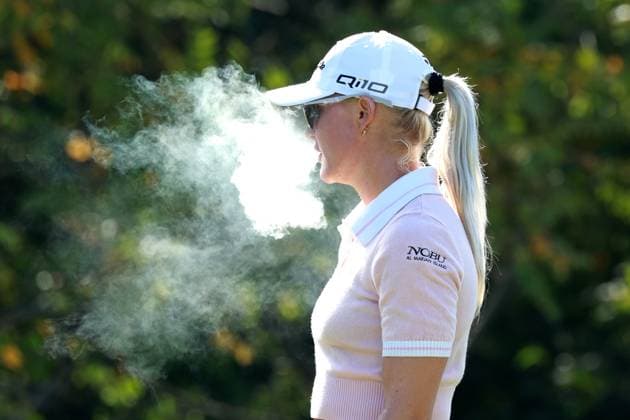 CINCINNATI, OH - SEPTEMBER 22: LPGA, Golf Damen golfer Charley Hull smokes a cigarette while waiting on the 8th tee during the final round of the Kroger Queen City Championship presented by P&G on September 22, 2024, at TPC River™s Bend in Cincinnati, Ohio. (Photo by Brian Spurlock Icon Sportswire) GOLF: SEP 22 LPGA Kroger Queen City Championship pres by P&G EDITORIAL USE ONLY Icon24092220