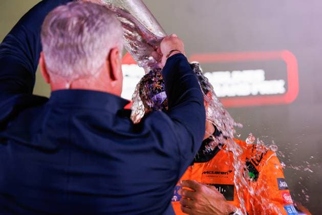 September 22, 2024, Singapore, Singapore: David Coutlthard (L) pours water over Lando Norris of Great Britain and McLaren Formula 1 Team after the F1 Grand Prix Singapore at the Marina Bay Street Circuit. Singapore Singapore - ZUMAs197 20240922_aaa_s197_112 Copyright: xGeorgexHitchensx