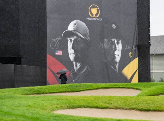 September 23, 2024, Montreal, Pq, CANADA: A man walks past a sign for the Presidents Cup golf tournament at the Royal Montreal Golf Club, Monday, Sept. 23, 2024 in Montreal. Canada News - September 23, 2024  - ZUMAc35_ 20240923_zaf_c35_033 Copyright: xChristinnexMuschix