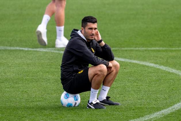 23 09 2024 Football training of Borussia Dortmund, season 2024 2025 at the training ground in Brackel Coach Nuri Sahin sits on a soccer Copyright: xDavidxInderliedx