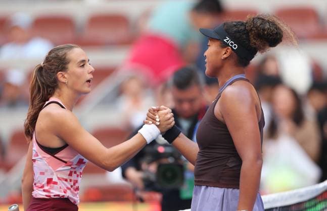 (240925) -- BEIJING, Sept. 25, 2024 -- Osaka Naomi of Japan shakes hands with Lucia Bronzetti of Italy after the women s singles first round match between Osaka Naomi of Japan and Lucia Bronzetti of Italy at the 2024 China Open tennis tournament in Beijing, capital of China, Sept. 25, 2024. ) (SP)CHINA-BEIJING-TENNIS-CHINA OPEN-WOMEN S SINGLES (CN) BaixXuefei 