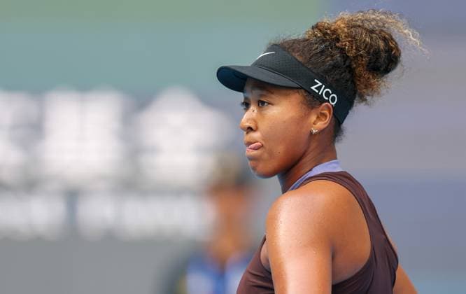 (240925) -- BEIJING, Sept. 25, 2024 -- Osaka Naomi of Japan reacts during the women s singles first round match against Lucia Bronzetti of Italy at the 2024 China Open tennis tournament in Beijing, capital of China, Sept. 25, 2024. ) (SP)CHINA-BEIJING-TENNIS-CHINA OPEN-WOMEN S SINGLES (CN) BaixXuefei 