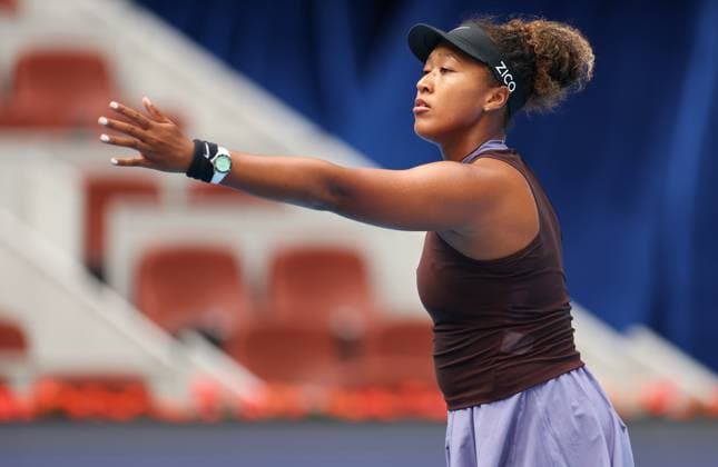 (240925) -- BEIJING, Sept. 25, 2024 -- Osaka Naomi of Japan reacts during the women s singles first round match against Lucia Bronzetti of Italy at the 2024 China Open tennis tournament in Beijing, capital of China, Sept. 25, 2024. ) (SP)CHINA-BEIJING-TENNIS-CHINA OPEN-WOMEN S SINGLES (CN) BaixXuefei 