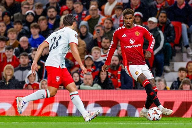 Marcus Rashford of Manchester United, ManU dribbles with the ball, defends by Bart van Rooij of FC Twente , UEFA Europa League 2024 25 League Phase MD1, Manchester United v FC Twente, Old Trafford, September 25, 2024, Manchester, England.